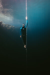 Freediver ascending the rope in the Blue Hole of Dahab in the Red Sea